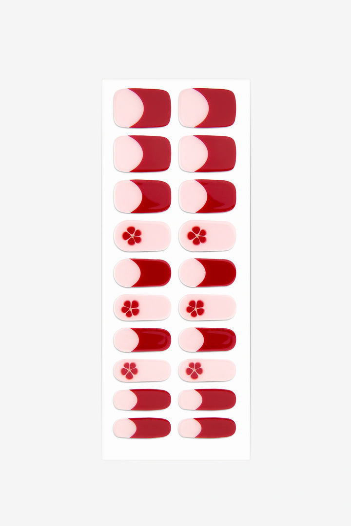 Full sheet of Sakura UV-free gel nail stickers displaying various sizes on a white background.