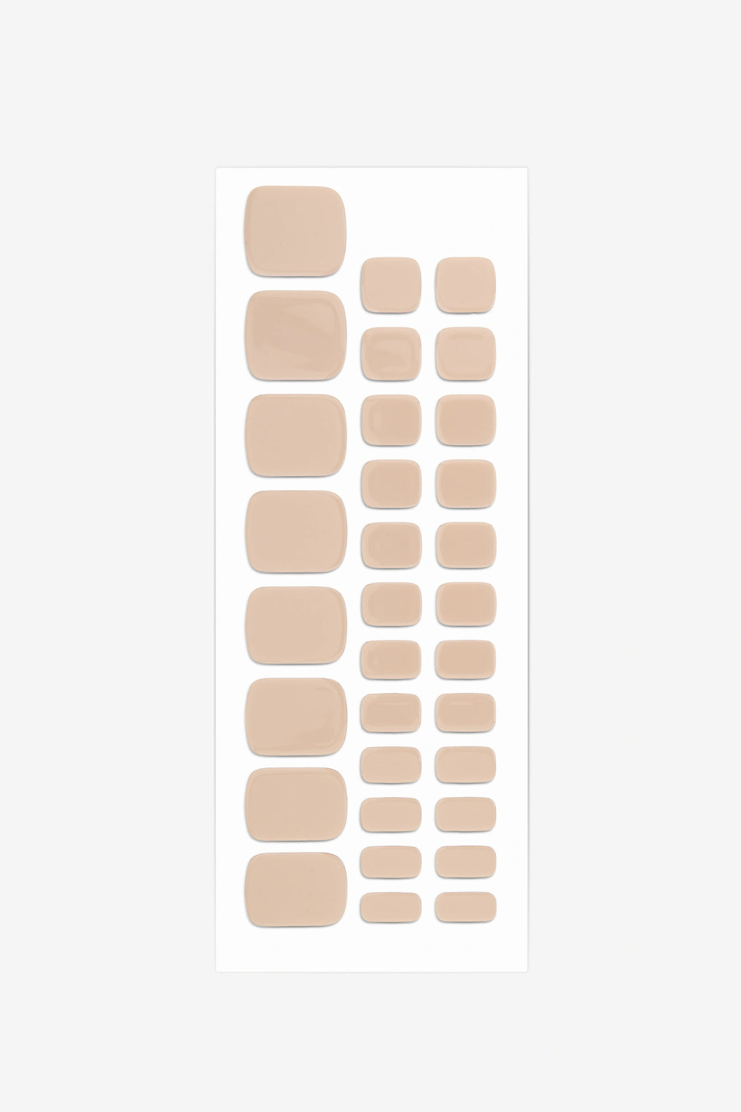Full sheet of Sandstone Beige semi-cured gel toenail stickers displaying various sizes on a white background.