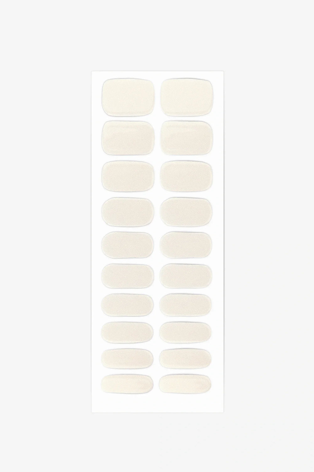 Sheet of semi-cured gel nail wraps in soft milky tones with fine gold-to-silver shimmer and a glossy surface.