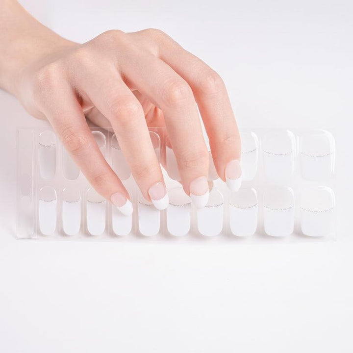 Sheet of French gel nail stickers with white bases and silver glitter accents.