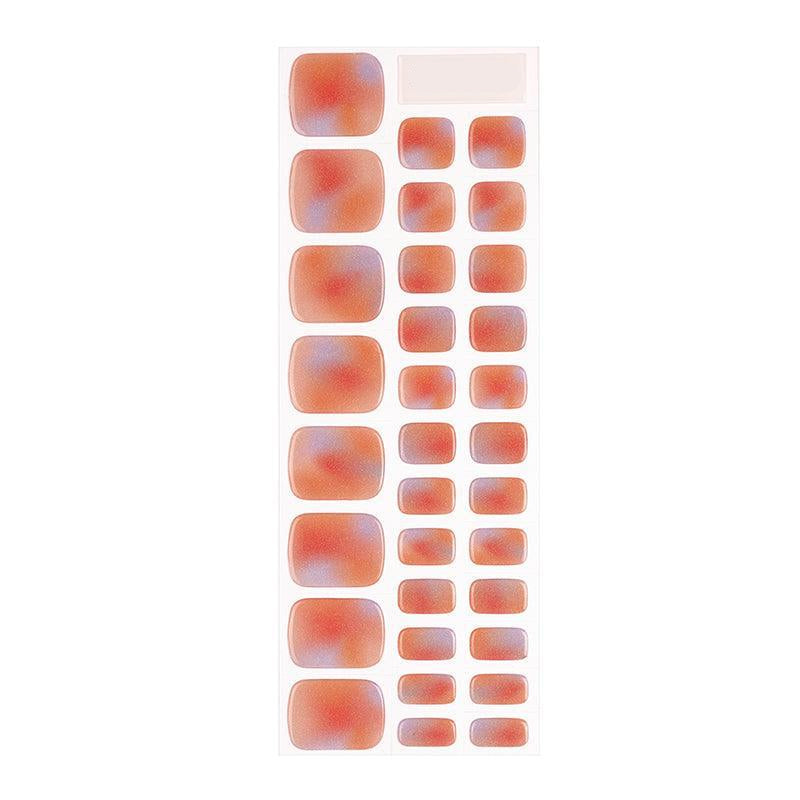 Sheet of shimmering rainbow gel toenail stickers with red, orange, and blue ombré gradients and a glossy, light-reflective finish.
