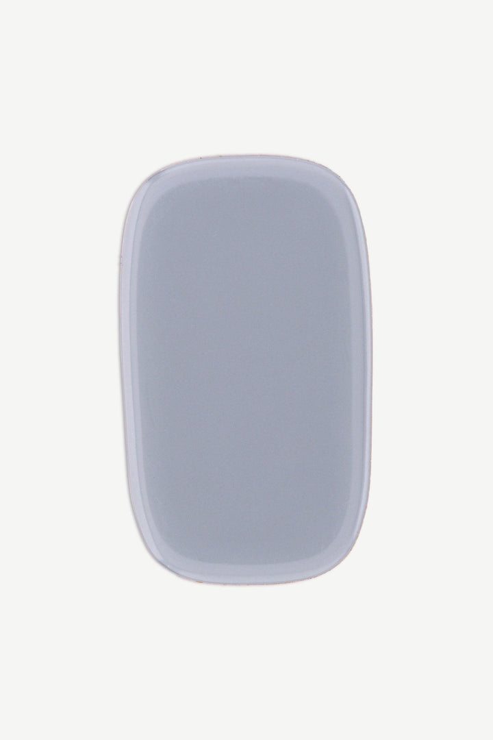 Single storm gray gel nail strip with smooth glossy surface and cool-toned sheen.