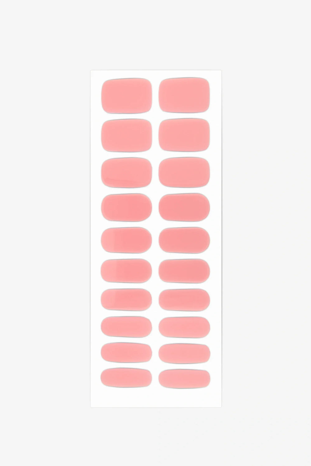 Sheet of semi-cured gel nail wraps in milky pastel pink shades with a glossy, translucent surface.