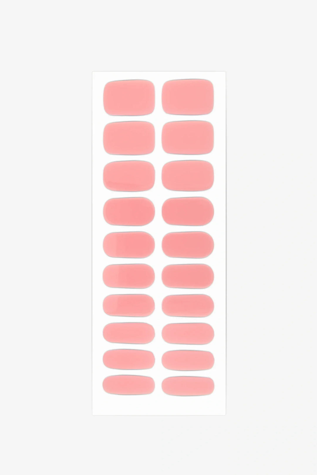 Sheet of semi-cured gel nail wraps in milky pastel pink shades with a glossy, translucent surface.