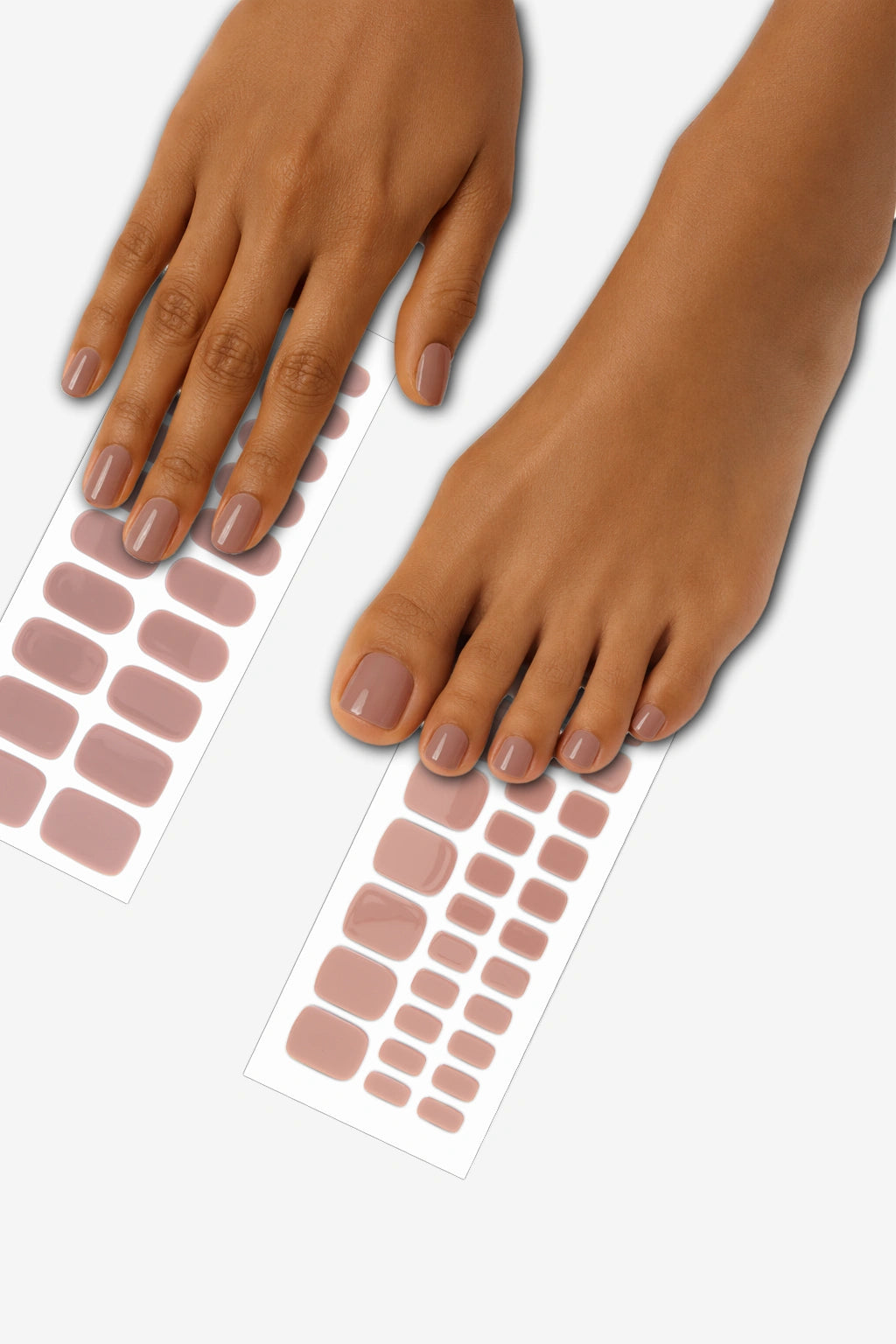 Taupe semi-cured gel nail wrap mani and pedi bundle applied on hands and feet, showing glossy neutral taupe finish with matching wrap sheets displayed underneath.