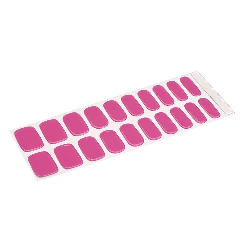 Sheet of translucent pink gel nail stickers with soft bubblegum hue and sheer finish on white background.