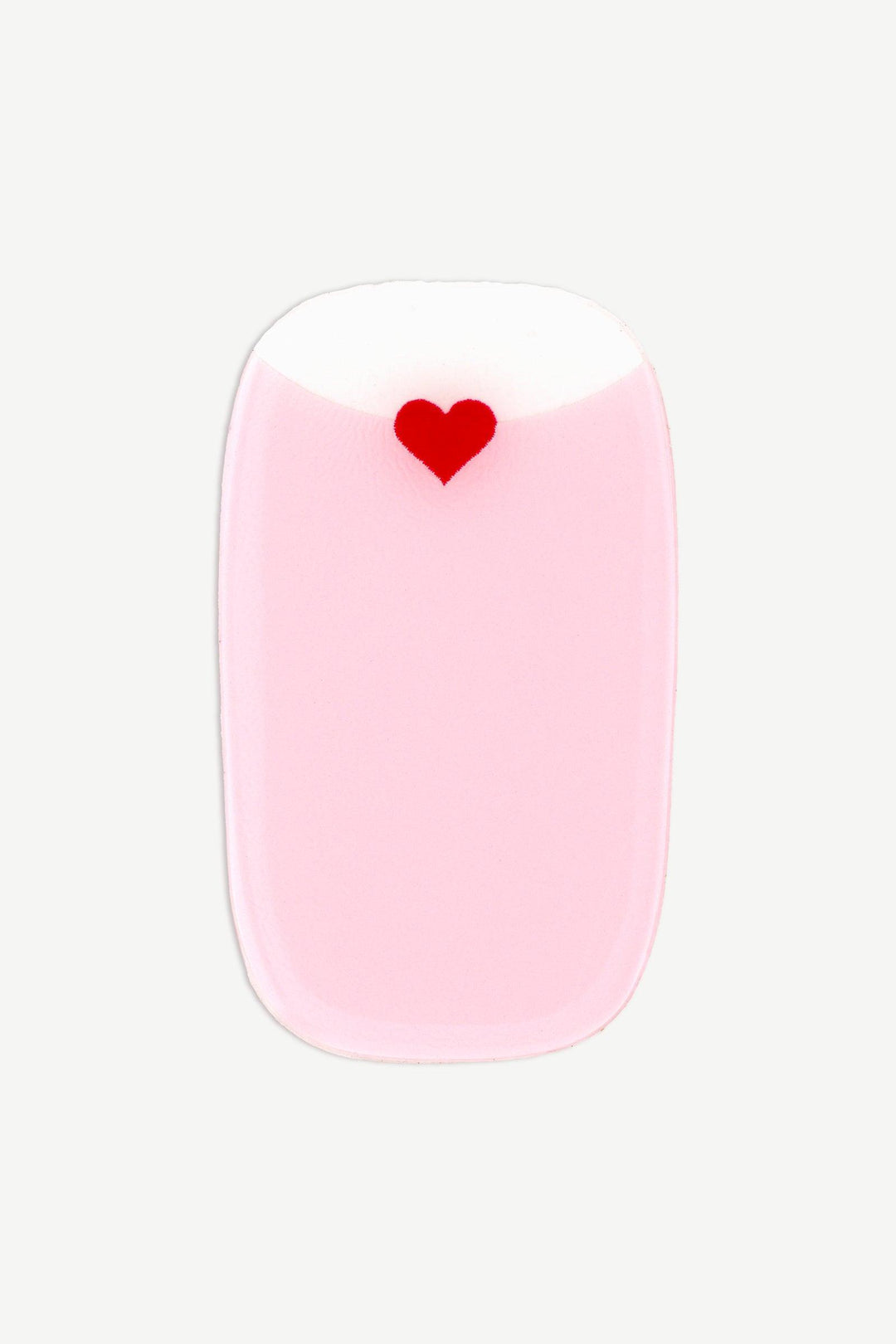 Close-up of a soft pink gel nail wrap with a tiny red heart detail near the transparent cuticle area.