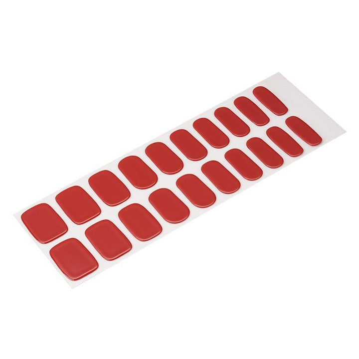 Sheet of wine red semi-cured gel nail strips with full opaque coverage and glossy surface.